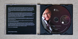 The slim jewelcase of the Stephen Hawking Tribute CD in an open state.